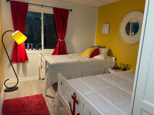 A small room with red curtains