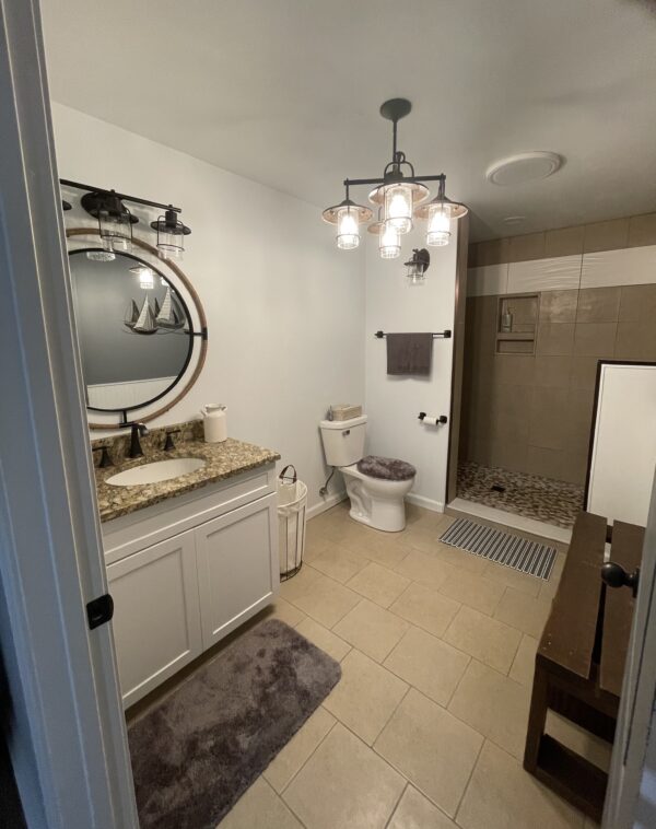 View of mirror and white cabinet inside bathroom